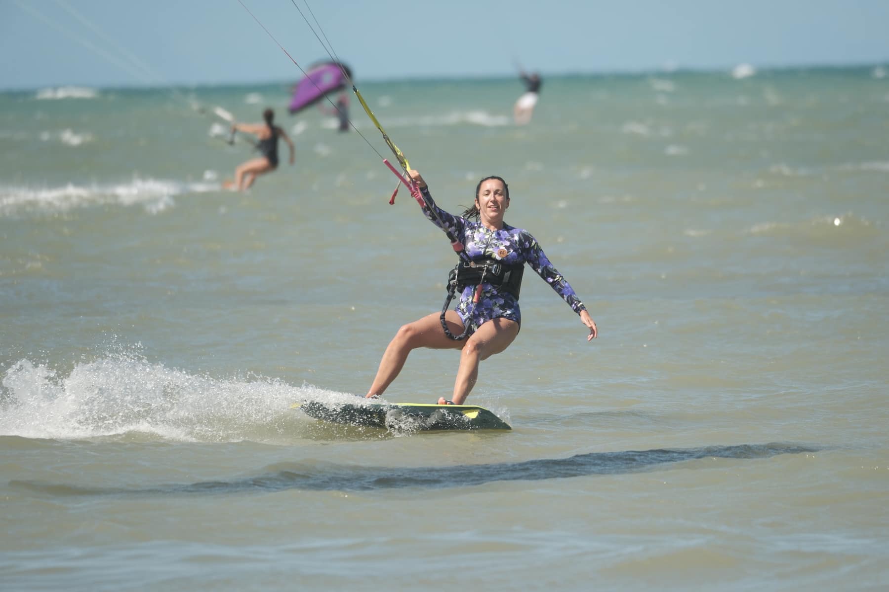 Woman riding in the water during a Brazil kite session