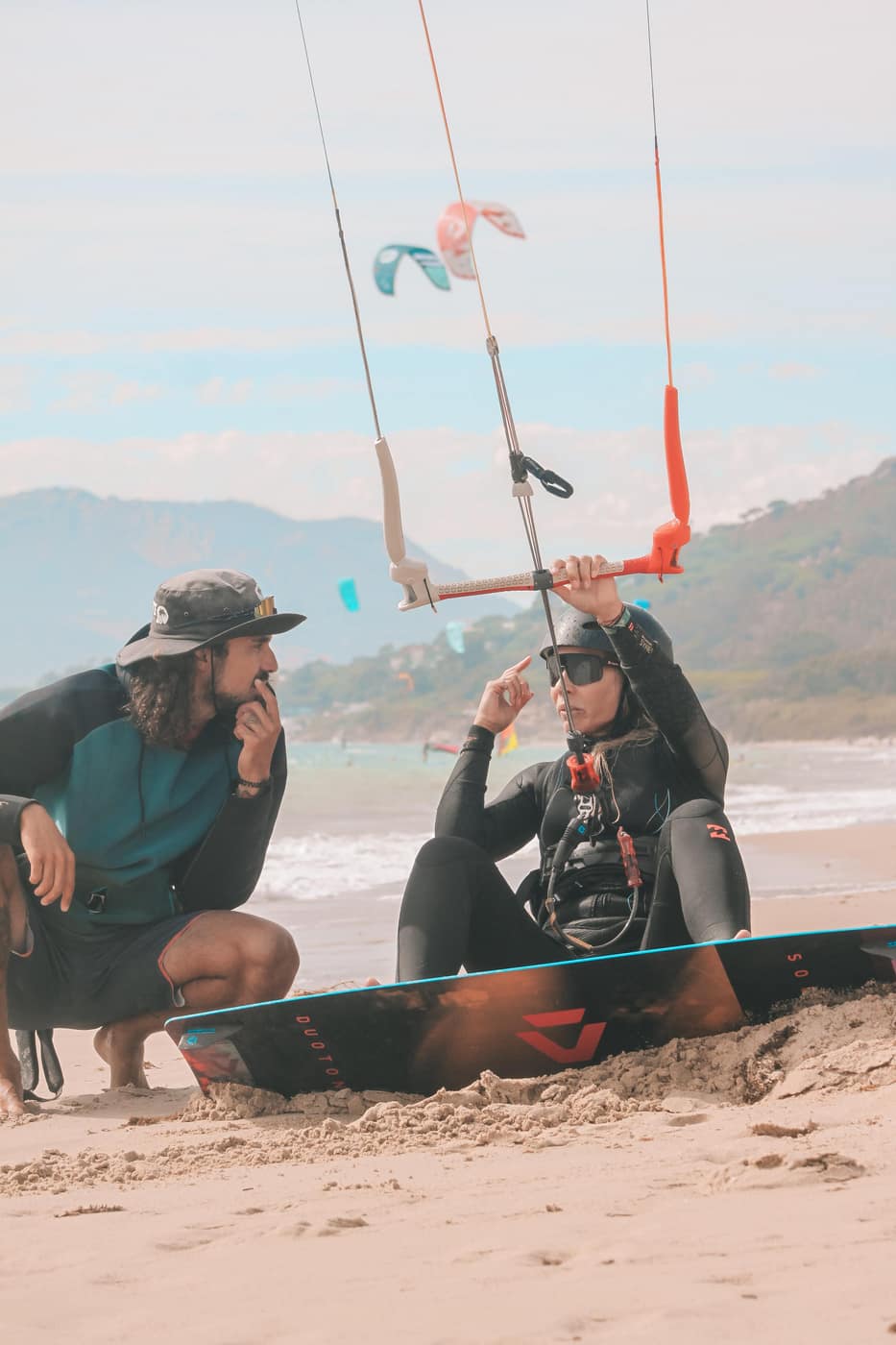 Woman kiting in Tarifa with soft ocean light
