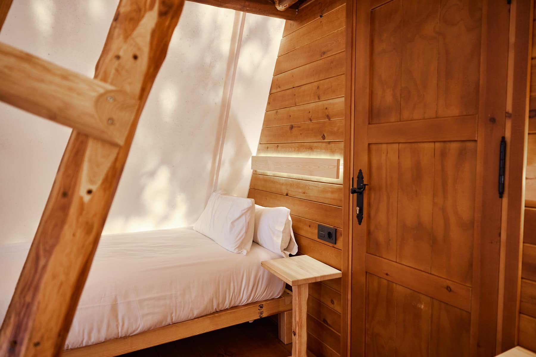 Cozy wooden glamping bedroom in Tarifa