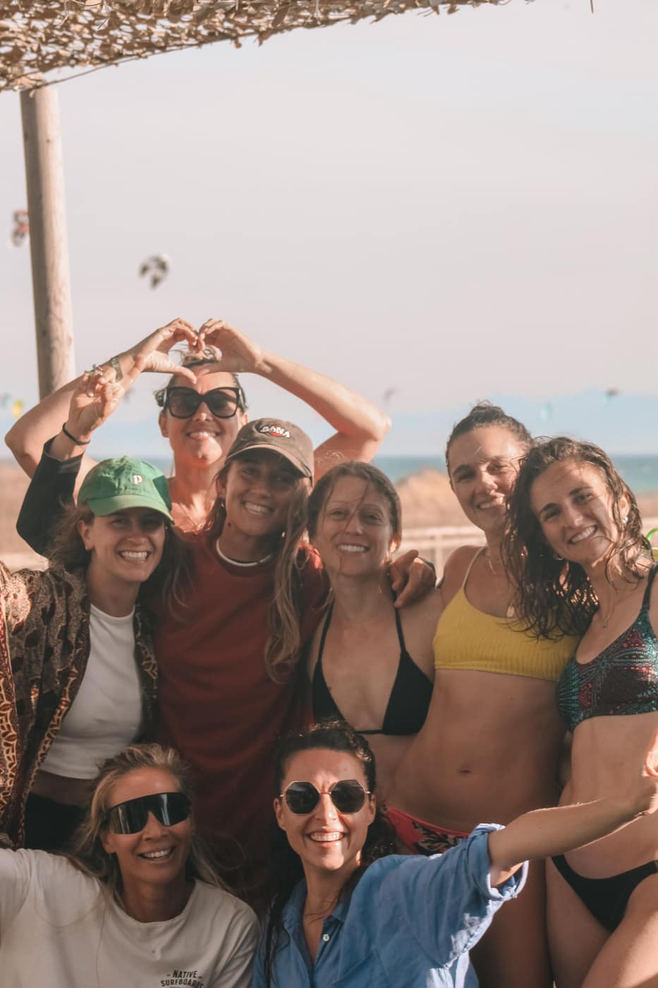 Group of women smiling together on a kite trip