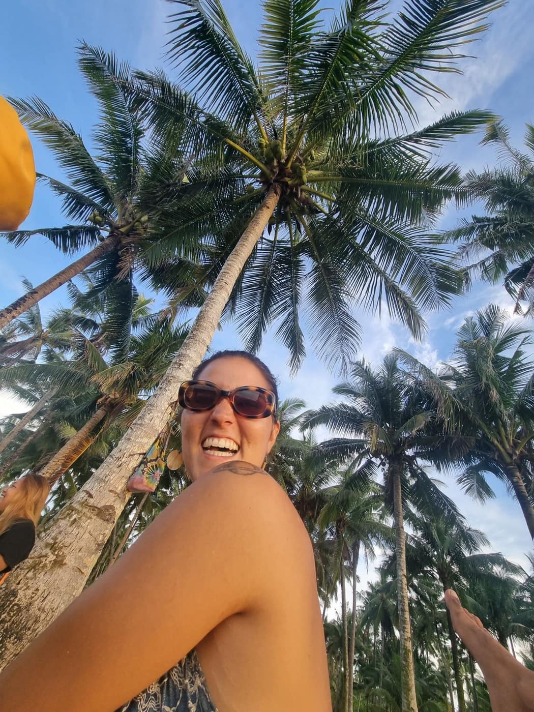 Lauri smiling on the beach after a kite session